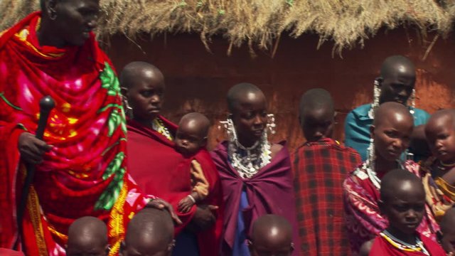Masai villagers in Tanzania posing for group portrait in traditional dress