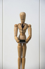 Wooden dummy with mobile smartphone