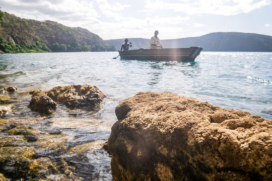 Africans in canoe on beautiful Chala lake, Kenya and Tanzania border