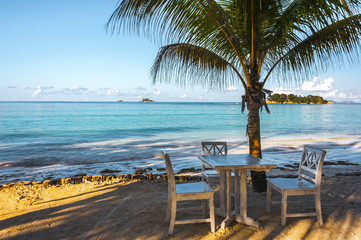 Beach of the Seychelles with table and chairs, Island Praslin, Beach Anse Volbert