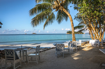 Beach of the Seychelles with table and chairs, Island Praslin, Beach Anse Volbert