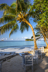 Beach of the Seychelles with table and chairs, Island Praslin, Beach Anse Volbert