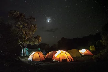 Papier Peint photo Kilimandjaro Illuminated tents on Kilimajaro, Marangu route, Tanzania