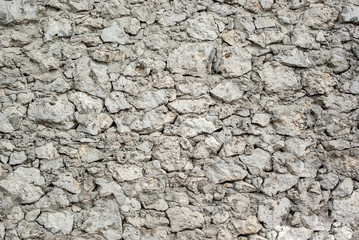 Molded concrete wall with white limestone stone