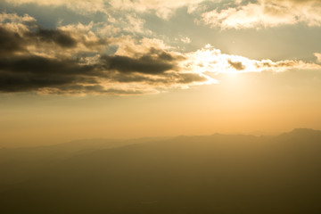 Fototapeta na wymiar Sunset at the Mountain Hill,Beautiful sunlight, Golden lights background