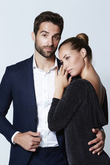 Glamorous couple in studio, portrait