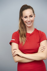 Obraz premium Confident athlete with arms folded, smiling