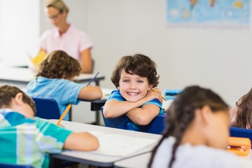 Smiling boy looking at camera during lesson