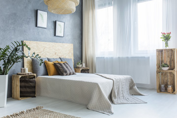 Grey bedroom with bed - obrazy, fototapety, plakaty