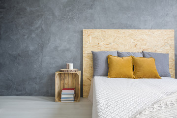 Grey bedroom with OSB bed