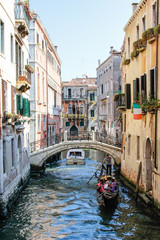 Venice canal, italian flag and gondola