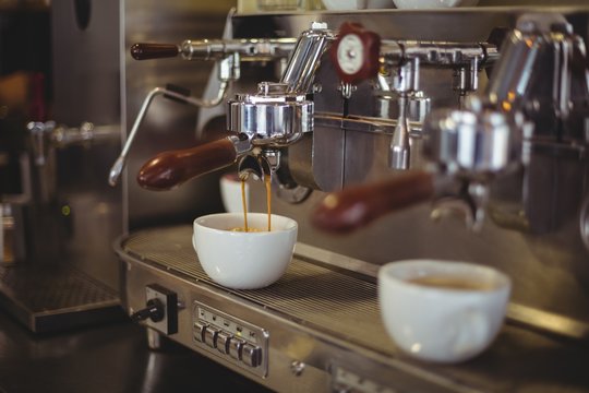 Close-up of espresso pouring from coffee machine