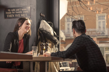 young woman man smiling, looking away window sideways