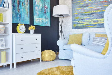 Navy room with yellow pouf