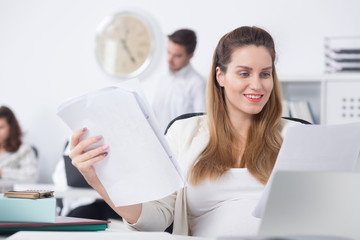 Pregnant woman doing paperwork