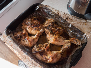 Chicken baked in the oven. Selective focus.