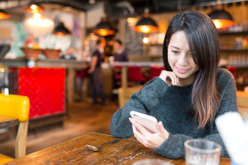 Woman reading on cellphone