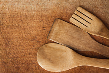 Wooden Serving spoons and fork on wooden surface