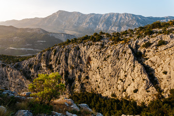The slope of the cliff in the rays of the sun near Omis, Croatia.