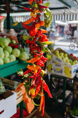 Red and green pepper hanging on the market in Omis, Croatia.