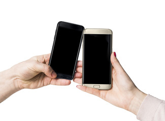 Gold and black smart phones with with blank blue screen copy space in female human hand isolated on white background