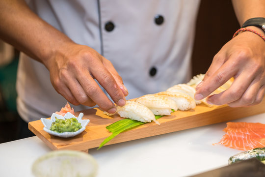 chef  preparing sushi in the restaurant kitchen