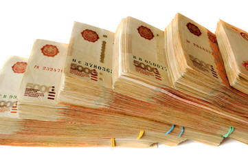 Packs of Russian paper money on a white background, as part of a business