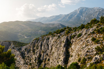 The slope of the cliff in the rays of the sun near Omis, Croatia.