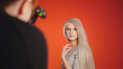 Beautiful girl posing for photographer - fashion backstage