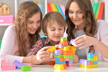 Family playing Bricks game