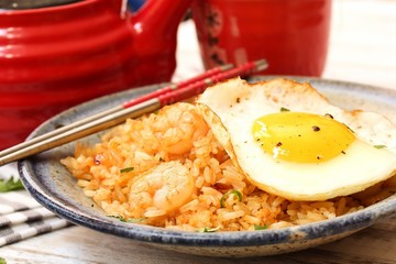Nasi Goreng -Indonesian Fried Rice served with egg, selective focus