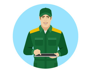 Man in uniform uses tabletdigital tablet PC