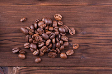 roasted coffee beans on wood background