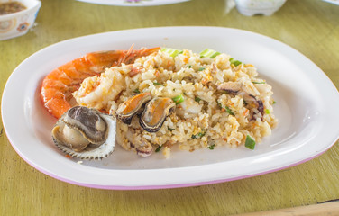 Healthy food. Seafood fried rice on wooden table. thai cuisine with selective focus.