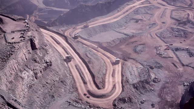 Dump trucks and other vehicles in a Copper mine.
Timelapse