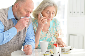 Elderly couple with pills