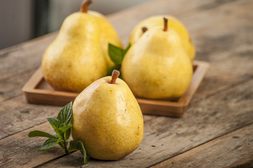 Fruit background. Fresh organic pears on old wood. Pear autumn harvest