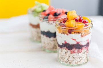 Oatmeal with fruit and cereals in a glass jar