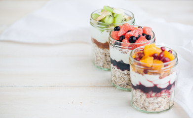 Oatmeal with fruit and cereals in a glass jar