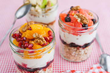 Oatmeal with fruit and cereals in a glass jar