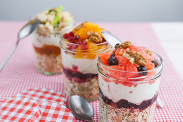 Oatmeal with fruit and cereals in a glass jar