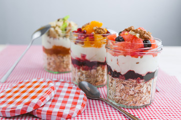 Oatmeal with fruit and cereals in a glass jar