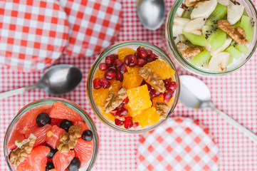 Oatmeal with fruit and cereals in a glass jar