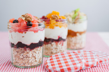 Oatmeal with fruit and cereals in a glass jar