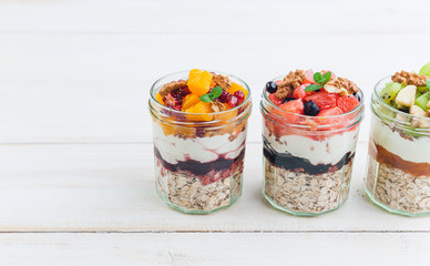 Oatmeal with fruit and cereals in a glass jar