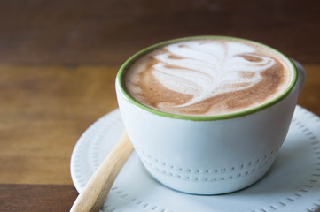 coffee cup and delicious cake strawberry and relax time moblie on table in coffee shop