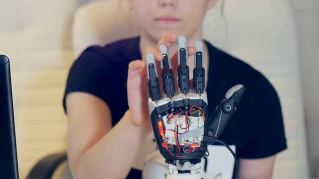 Human arm with robot arm. Futuristic robotic cyber technolgy roday. 4K.