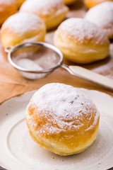 homemade donut with powder sugar