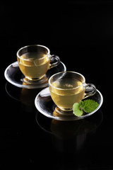 Herbal dry sri lanka tea. Mint leaf. Tea in a glass cup, mint le