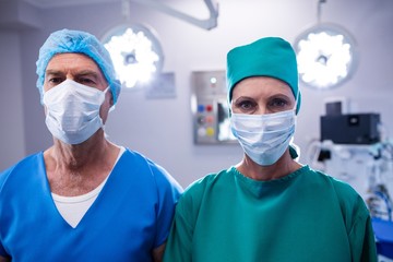 Fototapeta na wymiar Portrait of surgeons wearing surgical mask in operation theater